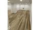 Finished basement area with wooden flooring and recessed lighting at 2543 Union St, Indianapolis, IN 46225