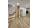 Finished basement with wooden floors, stairs, and stylish wood slat partition at 2543 Union St, Indianapolis, IN 46225