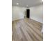 Empty bedroom with wood-look floors, fresh paint, and ample natural light at 2543 Union St, Indianapolis, IN 46225