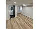 Bright bedroom with wood flooring, a window, and an attached bathroom at 2543 Union St, Indianapolis, IN 46225