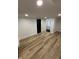 Inviting bedroom featuring hardwood floors, recessed lighting, and a connected bathroom at 2543 Union St, Indianapolis, IN 46225