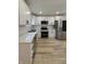 Stylish kitchen with stainless steel appliances, white cabinets, and a subway tile backsplash at 2543 Union St, Indianapolis, IN 46225
