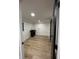Basement laundry room featuring a dark sink and neutral wooden tile at 2543 Union St, Indianapolis, IN 46225