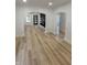 Spacious living room with luxury vinyl plank flooring, archway to other rooms, and neutral walls at 2543 Union St, Indianapolis, IN 46225