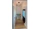 Stairwell featuring wooden stairs with a black door on the first level and a modern light fixture at 2543 Union St, Indianapolis, IN 46225
