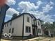 Two-story home featuring black trim, white siding, and double hung windows at 2879-81 N Dearborn St, Indianapolis, IN 46218