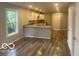 Open floor plan, kitchen with granite countertop and white cabinets at 2879-81 N Dearborn St, Indianapolis, IN 46218
