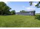 Expansive backyard with lush green grass and exterior view of the house at 2911 N 200 W Rd, Franklin, IN 46131