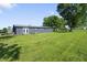 Expansive backyard with lush green grass and exterior view of the house at 2911 N 200 W Rd, Franklin, IN 46131