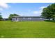 Expansive backyard with lush green grass and exterior view of the house at 2911 N 200 W Rd, Franklin, IN 46131