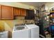 Basement laundry area featuring modern washing machine, dryer, and utility sink at 2911 N 200 W Rd, Franklin, IN 46131