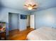 Spacious bedroom featuring hardwood floors, a ceiling fan, and a light blue paint scheme at 2911 N 200 W Rd, Franklin, IN 46131
