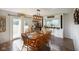 Charming dining room featuring hardwood floors, a wooden table with seating for eight, and a built-in wine rack at 2911 N 200 W Rd, Franklin, IN 46131