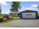 The detached garage is next to the ranch style home and vintage truck at 2911 N 200 W Rd, Franklin, IN 46131