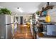 Open concept kitchen with butcher block countertops, white cabinets, and stainless steel refrigerator at 2911 N 200 W Rd, Franklin, IN 46131