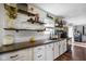 Charming kitchen featuring white cabinets, a dark countertop, and rustic wood shelving at 2911 N 200 W Rd, Franklin, IN 46131