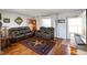 Cozy living room with wood flooring, leather sofas and natural light at 2911 N 200 W Rd, Franklin, IN 46131