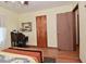 Bedroom with hardwood floors, desk, chair, and plenty of storage at 3059 Tansel Rd, Indianapolis, IN 46234