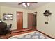 Bedroom featuring hardwood floors and a unique cuckoo clock at 3059 Tansel Rd, Indianapolis, IN 46234