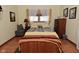 Comfortable bedroom featuring hardwood floors, natural light, and a calming color palette at 3059 Tansel Rd, Indianapolis, IN 46234