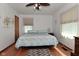 Cozy bedroom with hardwood floors, ceiling fan, and ample natural light at 3059 Tansel Rd, Indianapolis, IN 46234