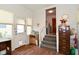 Bright mudroom features wood-look flooring, white paneled walls, and convenient access to the home's interior at 3059 Tansel Rd, Indianapolis, IN 46234