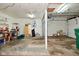 Spacious garage area with ample room for parking, storage and a workbench, illuminated by overhead lighting at 3059 Tansel Rd, Indianapolis, IN 46234