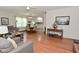 Cozy living room with hardwood floors flowing into dining and kitchen areas for easy living at 3059 Tansel Rd, Indianapolis, IN 46234