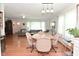 Open-concept living room and dining area with hardwood floors and lots of natural light at 3059 Tansel Rd, Indianapolis, IN 46234