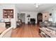 Spacious living room with hardwood floors, a ceiling fan, and views into other living areas at 3059 Tansel Rd, Indianapolis, IN 46234
