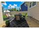 Cozy outdoor patio featuring a seating area and a swing, perfect for enjoying the backyard at 3059 Tansel Rd, Indianapolis, IN 46234
