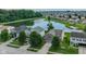 Aerial shot of a home near a tranquil lake, showcasing its well-manicured lawn and inviting surroundings at 3075 W Crosscreek Dr, Monrovia, IN 46157