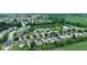 Beautiful aerial view of a suburban neighborhood with a pond and green spaces, offering a serene community setting at 3075 W Crosscreek Dr, Monrovia, IN 46157