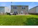 Large backyard featuring lush lawn, patio area, and well-maintained fence, perfect for outdoor activities at 3075 W Crosscreek Dr, Monrovia, IN 46157