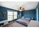 Bedroom featuring a ceiling fan, large windows, and neutral carpet at 3075 W Crosscreek Dr, Monrovia, IN 46157
