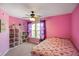 Bedroom featuring a ceiling fan, built in shelving, and natural light at 3075 W Crosscreek Dr, Monrovia, IN 46157