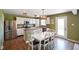 Eat-in kitchen features white cabinetry, stainless steel appliances and adjacent dining area for casual meals at 3075 W Crosscreek Dr, Monrovia, IN 46157