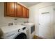 Well-lit laundry room featuring upper cabinets and modern LG appliances at 3075 W Crosscreek Dr, Monrovia, IN 46157