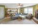 Open-concept living room flowing into kitchen, fireplace, and a large sectional sofa, perfect for Gathering gatherings at 3075 W Crosscreek Dr, Monrovia, IN 46157