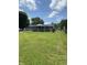 Large backyard with deck, play area, and a house with a screened in porch at 31 S Sugar Creek Dr, New Palestine, IN 46163