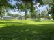Lush backyard with mature trees providing plenty of shade and privacy at 31 S Sugar Creek Dr, New Palestine, IN 46163