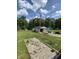 Spacious backyard featuring a large garage, play area and lush greenery at 31 S Sugar Creek Dr, New Palestine, IN 46163