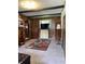 Bedroom with wood paneled accent wall, neutral carpet, and ample closet space at 31 S Sugar Creek Dr, New Palestine, IN 46163