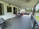 Relaxing covered deck with outdoor seating, perfect for enjoying the outdoors at 31 S Sugar Creek Dr, New Palestine, IN 46163