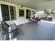 Spacious back deck with a covered area, outdoor seating, and a relaxing atmosphere at 31 S Sugar Creek Dr, New Palestine, IN 46163