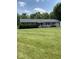 Charming single-story home with a well-manicured front yard and mature landscaping at 31 S Sugar Creek Dr, New Palestine, IN 46163