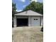 A two-car garage with a wide door and ample space for vehicles or storage at 31 S Sugar Creek Dr, New Palestine, IN 46163