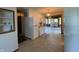 Bright kitchen area, seamlessly connected to sunroom, with an open layout and white cabinetry at 31 S Sugar Creek Dr, New Palestine, IN 46163