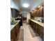 Efficient kitchen featuring dark wood cabinets, laminate countertops and a practical layout at 31 S Sugar Creek Dr, New Palestine, IN 46163