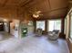 Open living room with wood ceiling, exposed brick, and inviting seating area at 31 S Sugar Creek Dr, New Palestine, IN 46163
